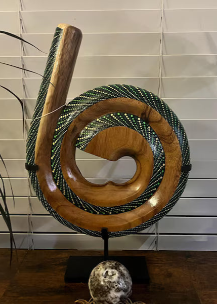Spirald Didgeridoo On a Stand in a customers home